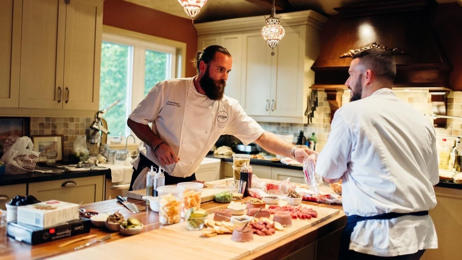 Prime Restaurant chefs preparing a charcuterie board.